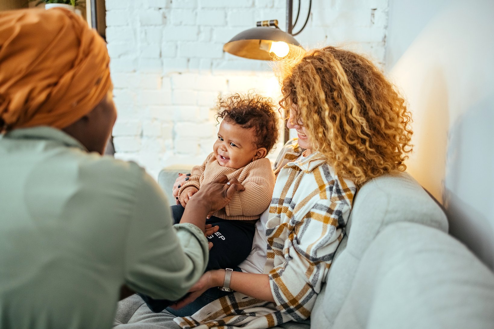 Gay couple with baby at home